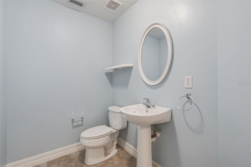 25134 Palisade Road Punta Gorda, FL 33983 - Photo 31 of 58 a bathroom with a sink toilet and a mirror