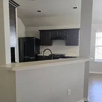 a close view of sink and refrigerator