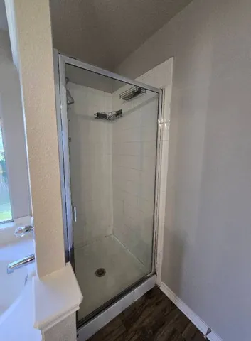 a bathroom with a bathtub and window