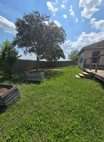 a view of a balcony with wooden floor