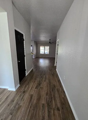 a view of gallery with wooden floor