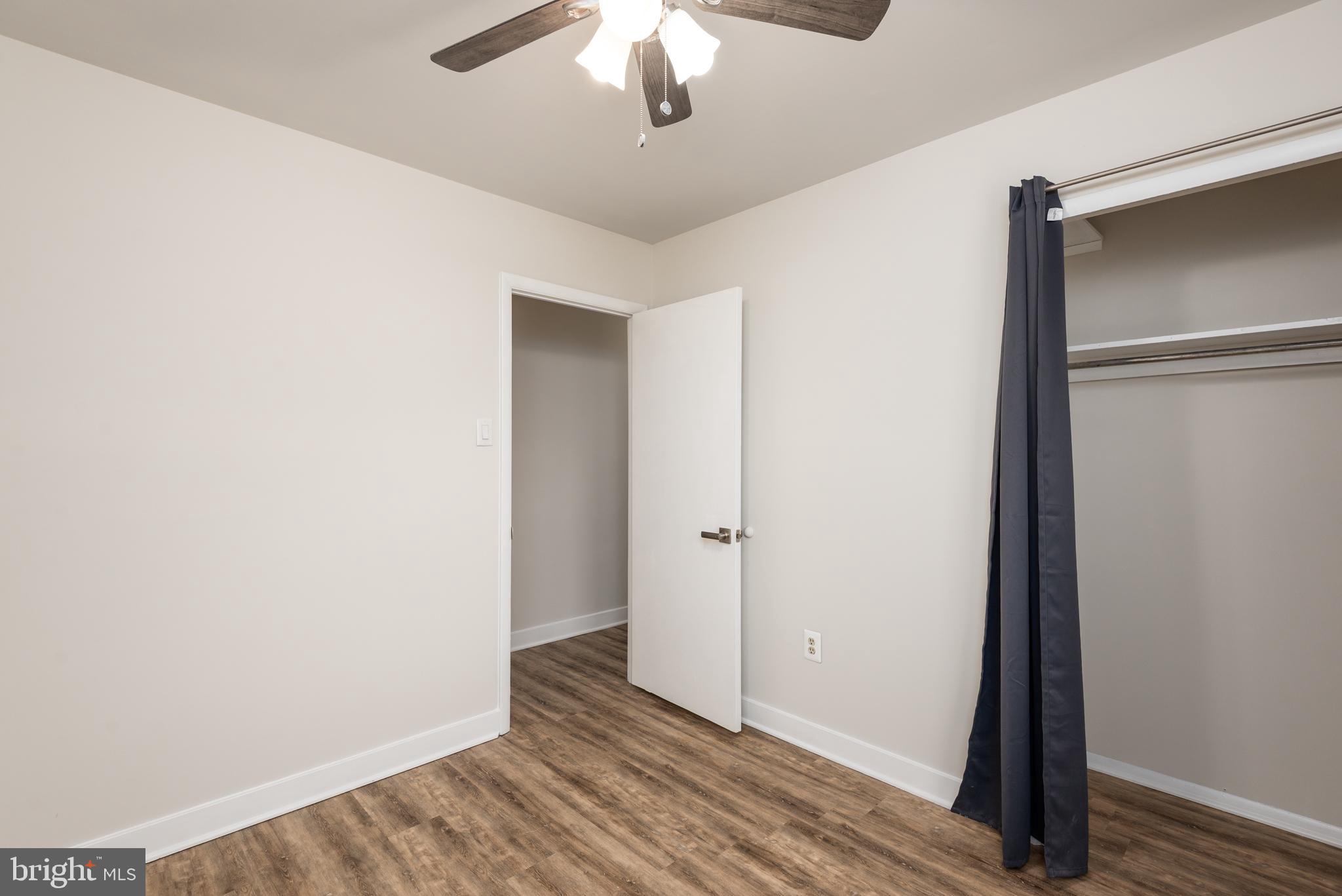 724 Chapelgate Drive Odenton, MD 21113 - Photo 14 of 26 a view of an empty room with wooden floor