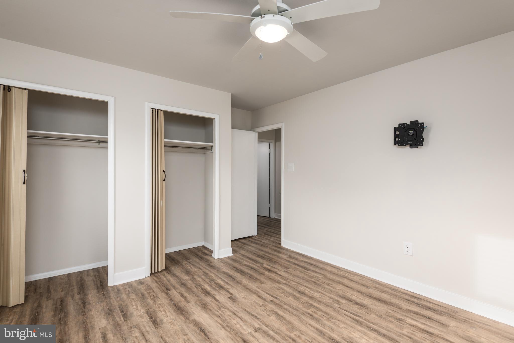 724 Chapelgate Drive Odenton, MD 21113 - Photo 18 of 26 a view of an empty room with wooden floor