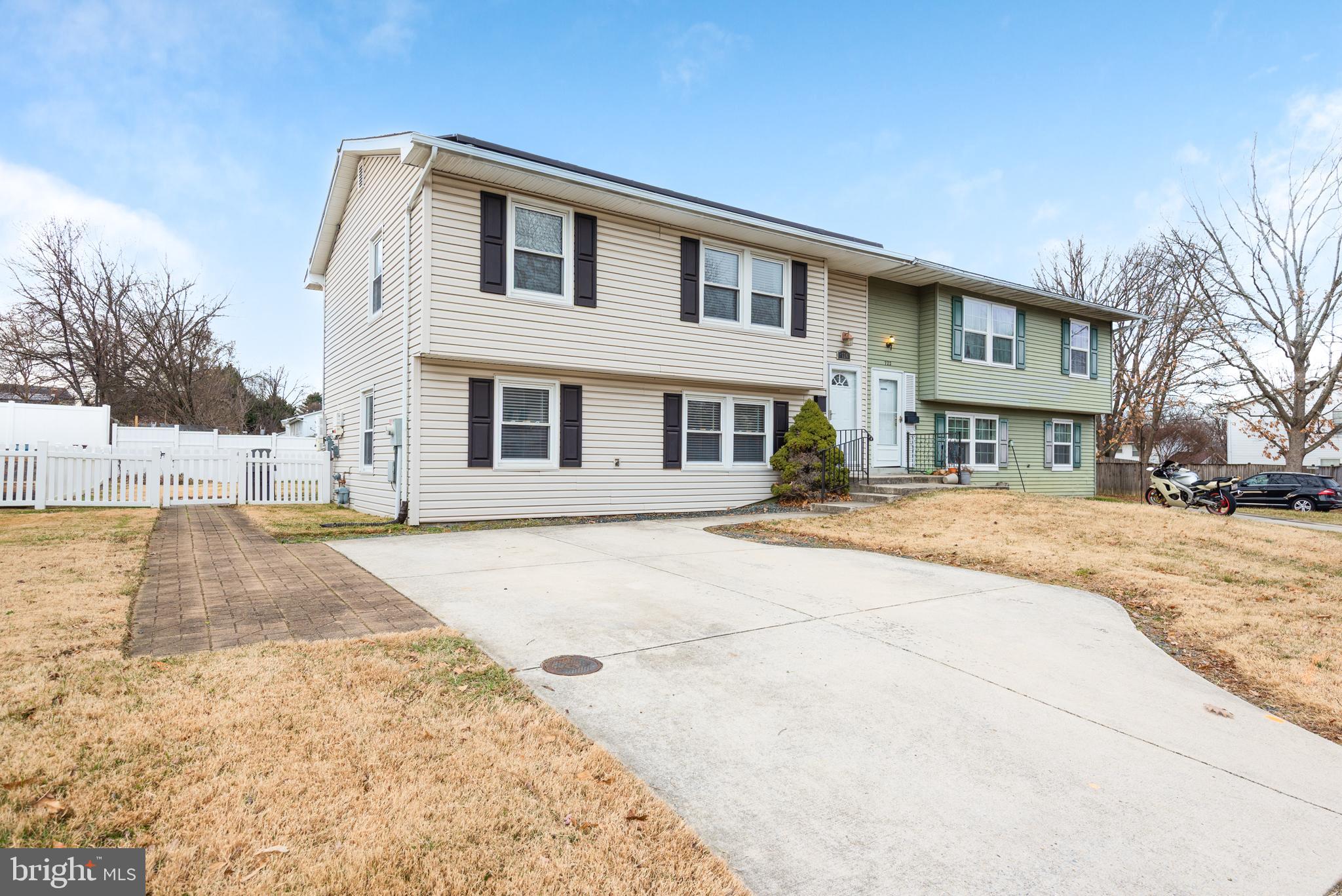 724 Chapelgate Drive Odenton, MD 21113 - Photo 2 of 26 a front view of a building with a yard