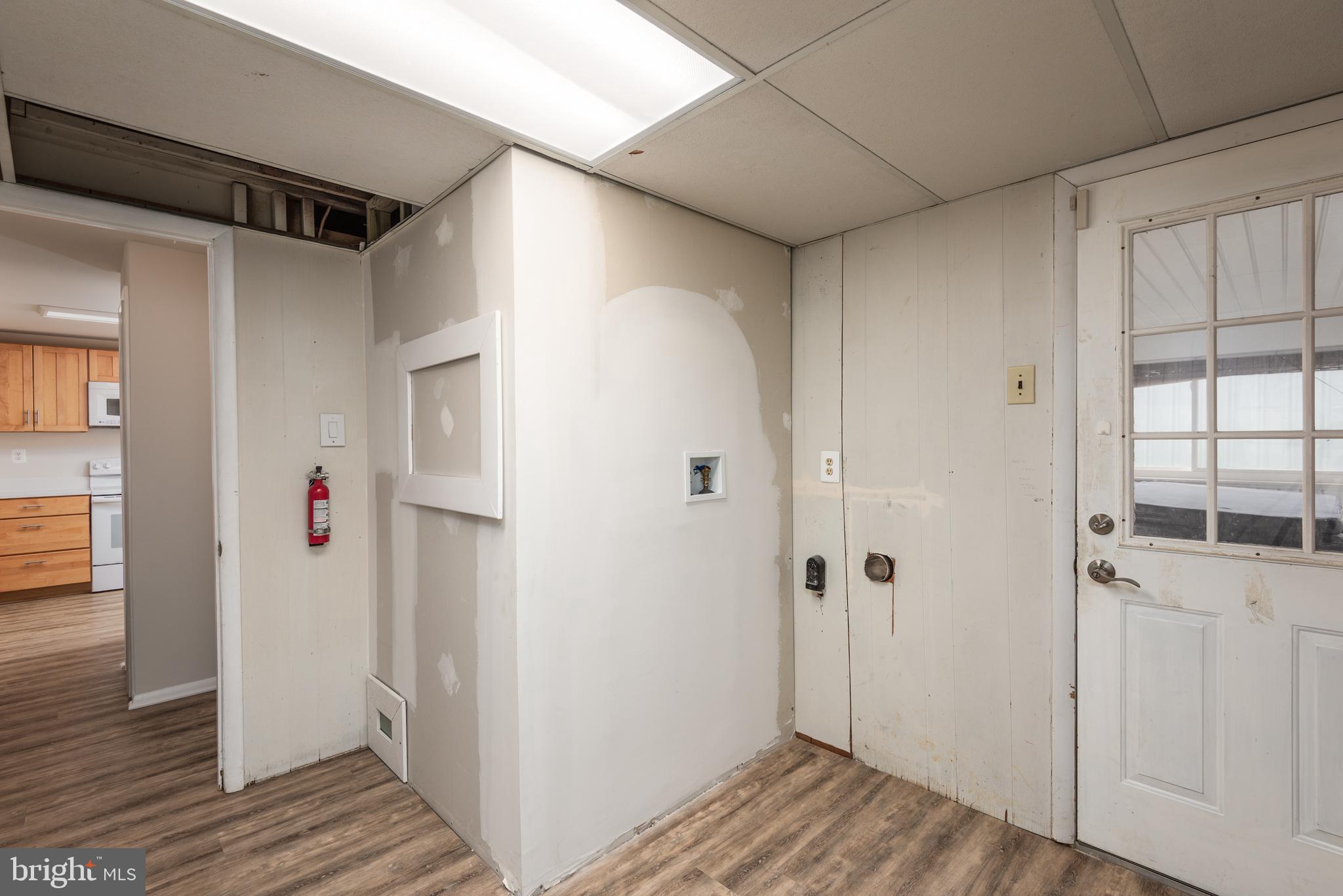 724 Chapelgate Drive Odenton, MD 21113 - Photo 26 of 26 a view of a hallway with wooden floor and closet area