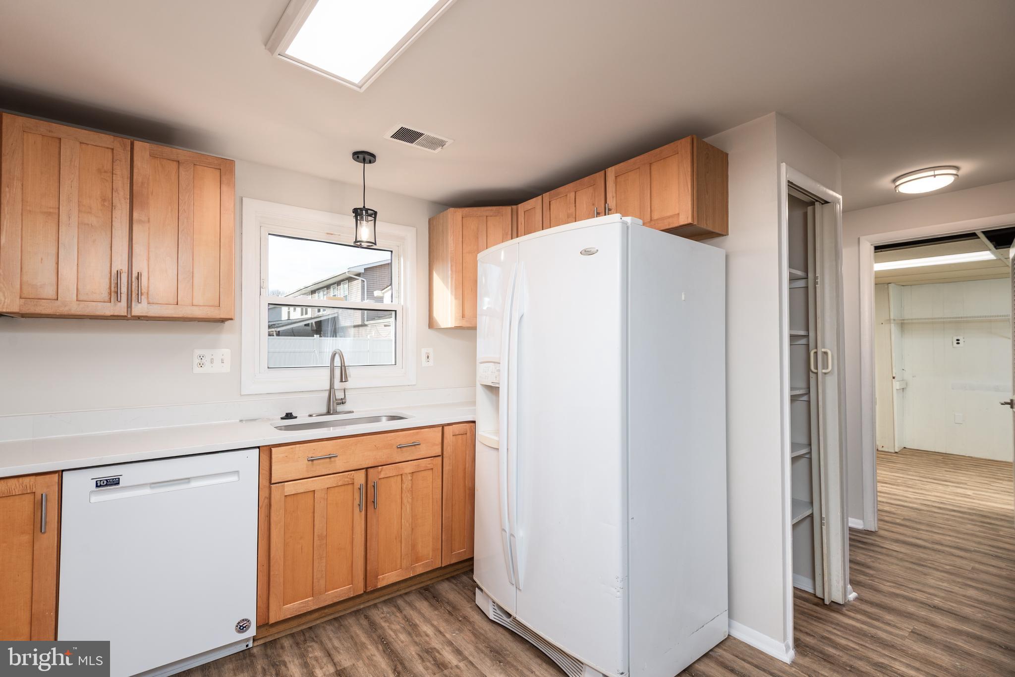 724 Chapelgate Drive Odenton, MD 21113 - Photo 5 of 26 a white refrigerator freezer sitting inside of a kitchen