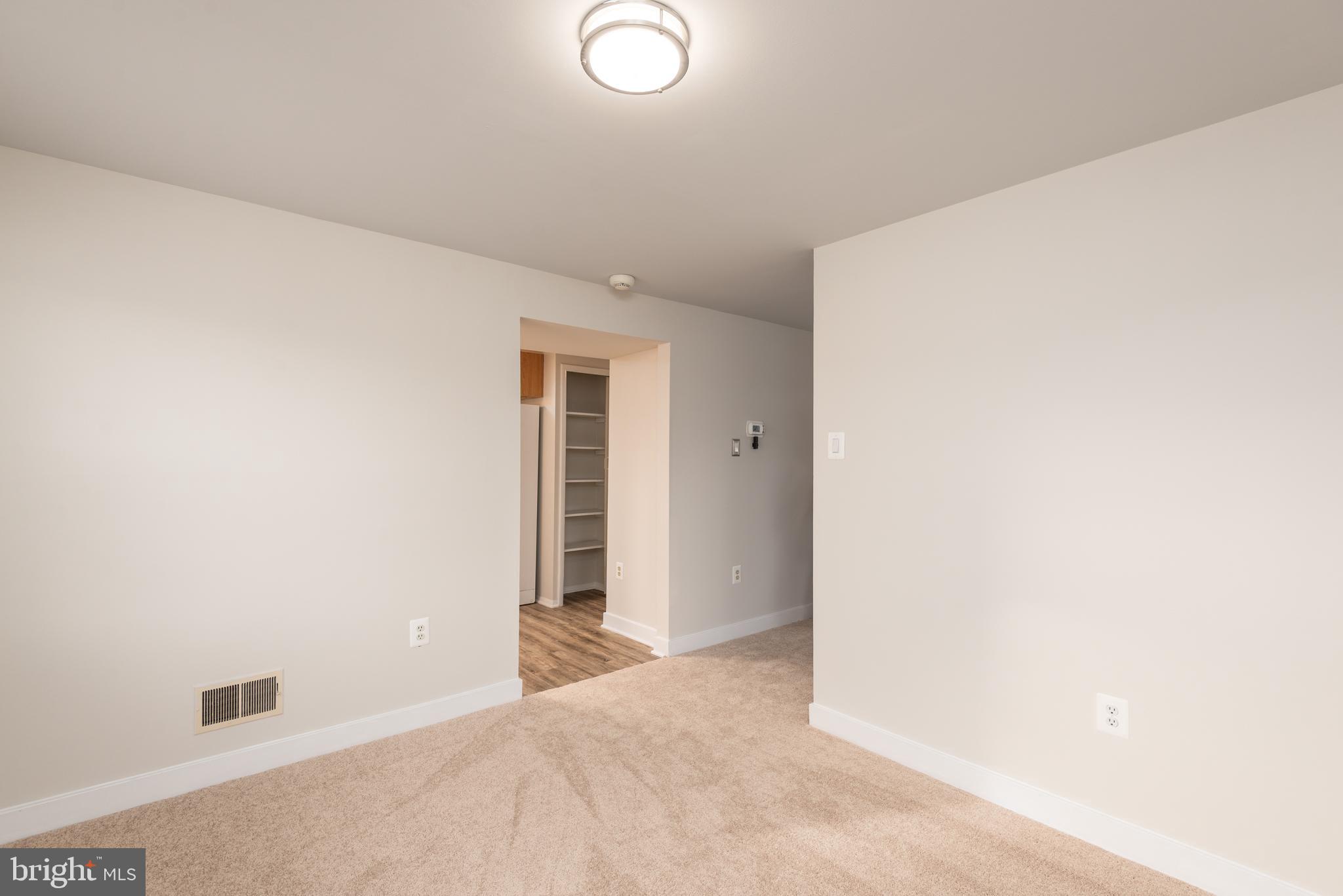 724 Chapelgate Drive Odenton, MD 21113 - Photo 10 of 26 a view of a livingroom with wooden floor and a window