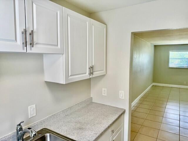 550 Southwest 2nd Avenue, Unit 224 Boca Raton, FL 33432 - Photo 12 of 33 a view of kitchen with granite countertop white cabinets and sink