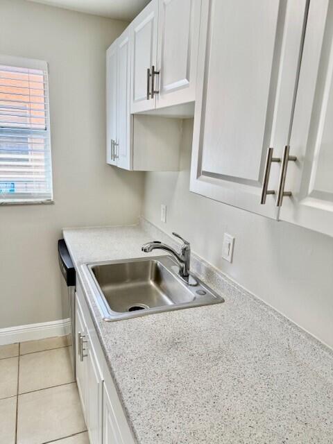 550 Southwest 2nd Avenue, Unit 224 Boca Raton, FL 33432 - Photo 14 of 33 a kitchen with sink a microwave and cabinets