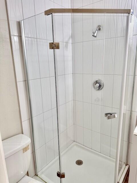 550 Southwest 2nd Avenue, Unit 224 Boca Raton, FL 33432 - Photo 28 of 33 a bathroom with a shower and toilet
