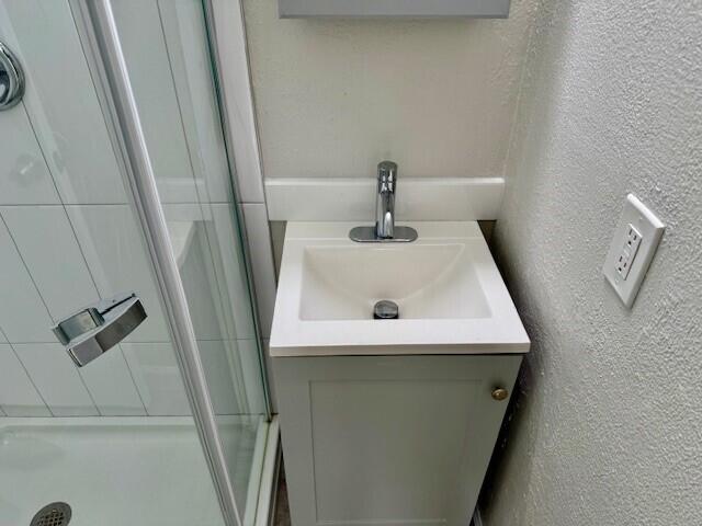 550 Southwest 2nd Avenue, Unit 224 Boca Raton, FL 33432 - Photo 31 of 33 a bathroom with a sink and mirror