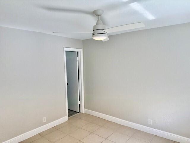 550 Southwest 2nd Avenue, Unit 224 Boca Raton, FL 33432 - Photo 33 of 33 an empty room with a window and ceiling fan