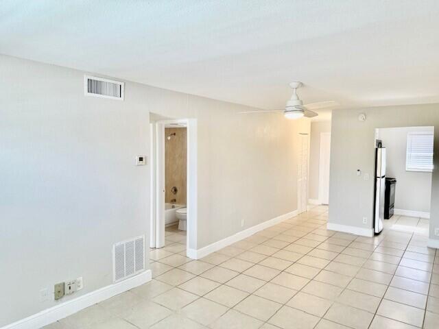 550 Southwest 2nd Avenue, Unit 224 Boca Raton, FL 33432 - Photo 4 of 33 a view of a hallway with wooden shelves