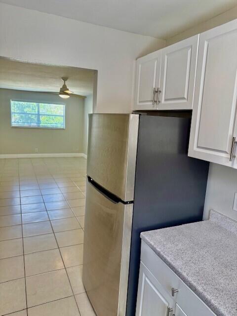 550 Southwest 2nd Avenue, Unit 224 Boca Raton, FL 33432 - Photo 8 of 33 a kitchen with granite countertop a refrigerator and a sink