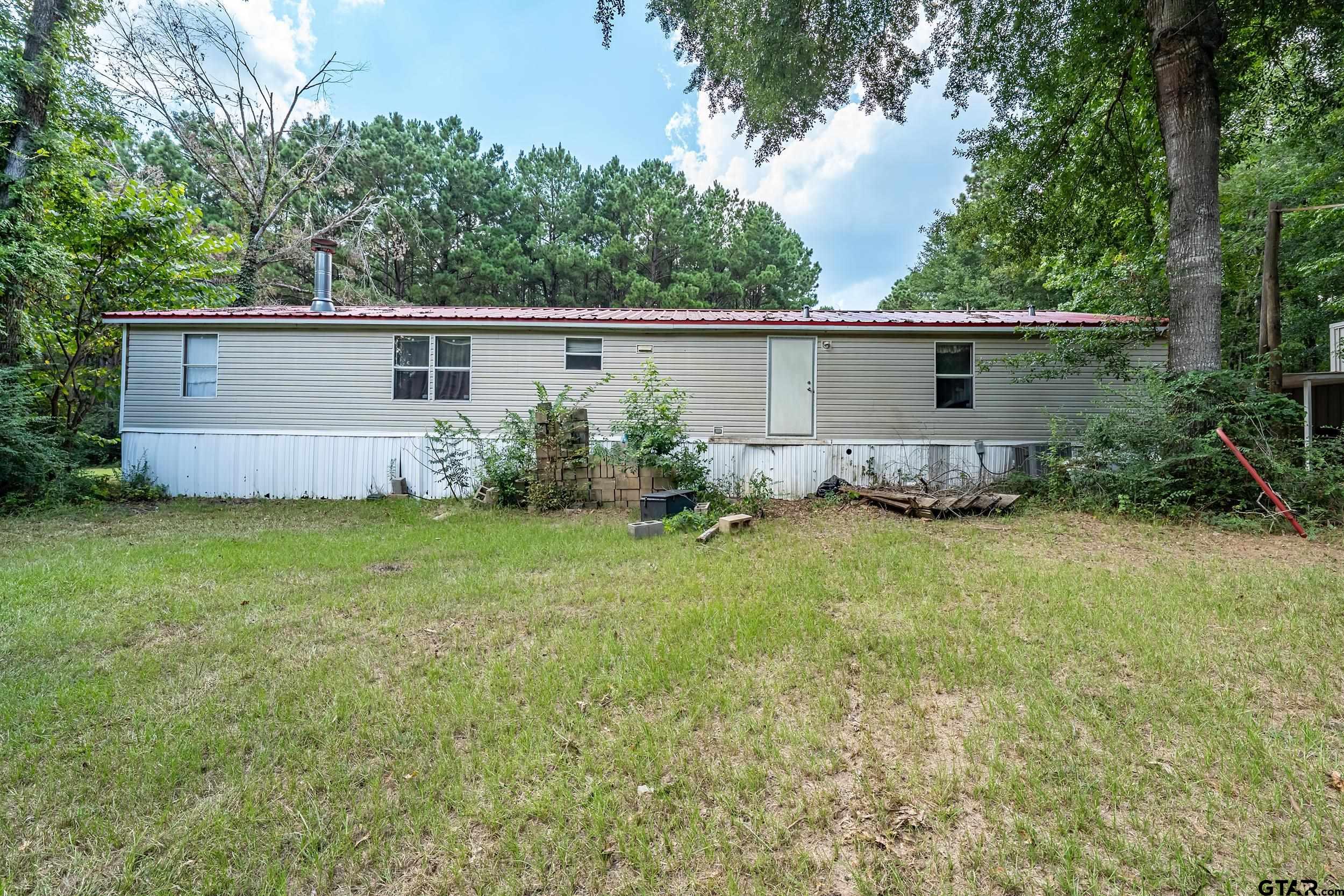 1655 County Road 2120 Rusk, TX 75785 - Photo 13 of 37 a view of a backyard