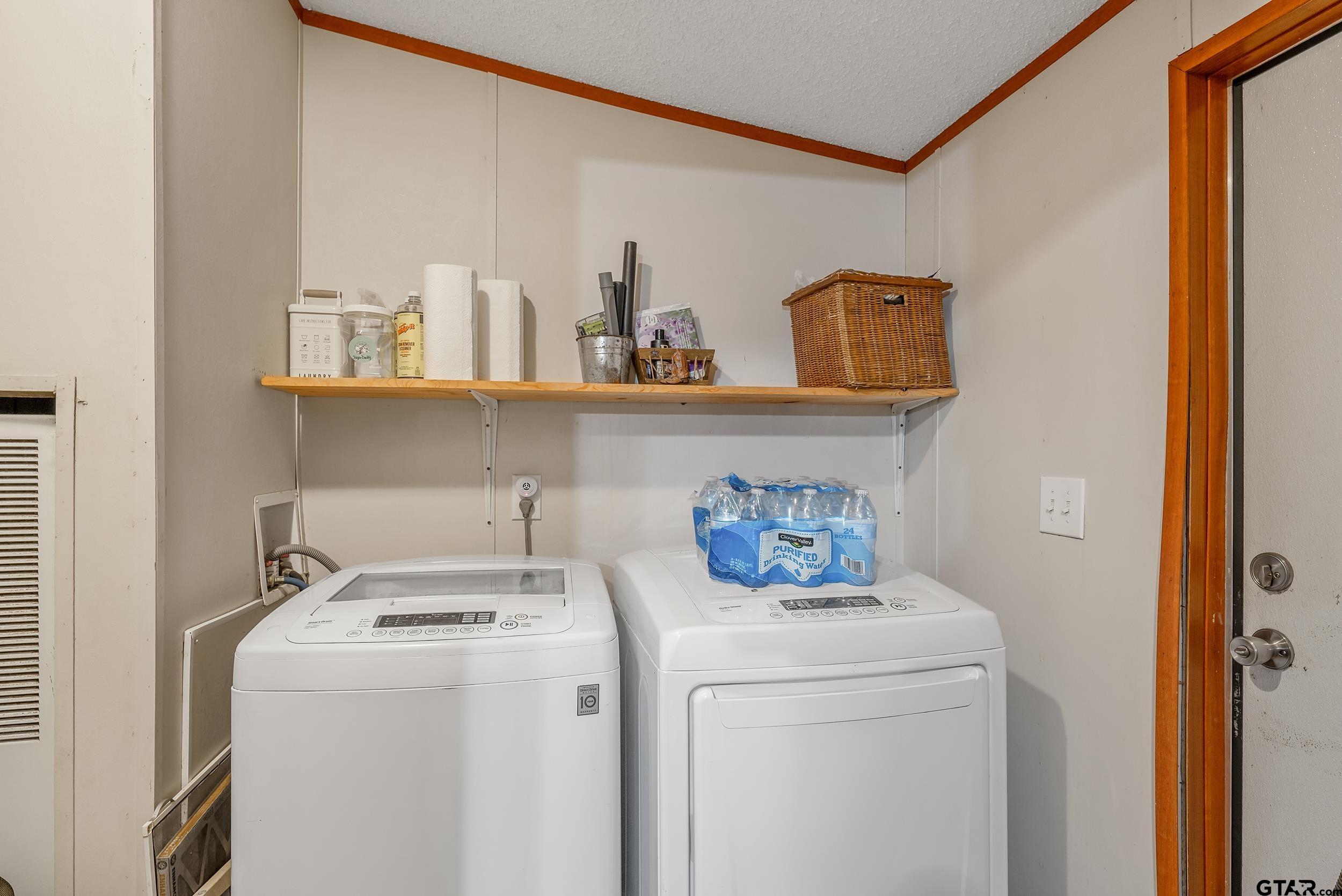 1655 County Road 2120 Rusk, TX 75785 - Photo 21 of 37 a view of storage and utility room with washer and dryer