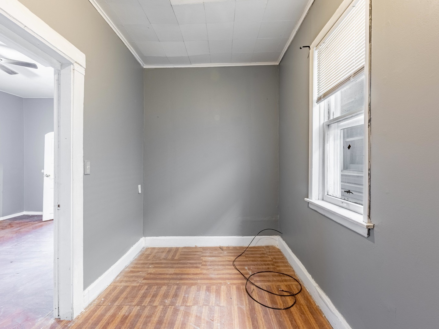 4722 South Ada Street Chicago, IL 60609 - Photo 11 of 14 a view of a bedroom with wooden floor and a window