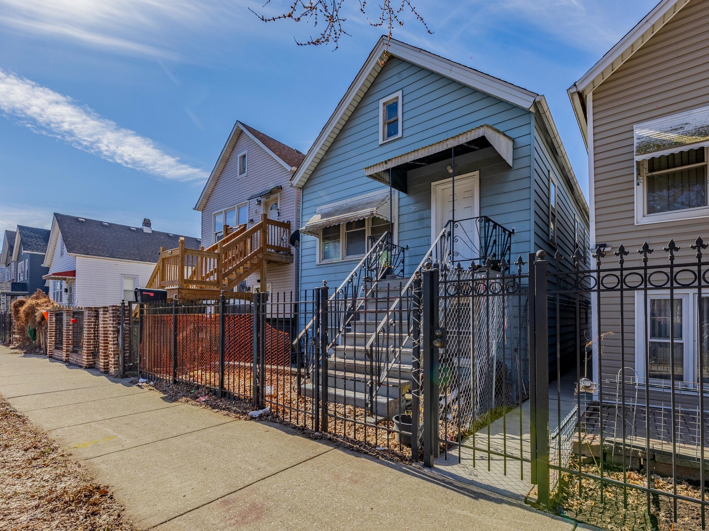 4722 South Ada Street Chicago, IL 60609 - Photo 14 of 14 a view of a house with wooden fence