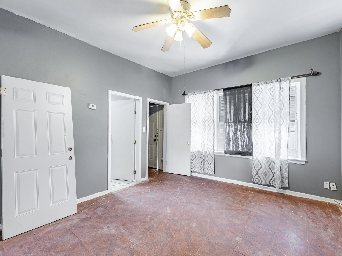 4722 South Ada Street Chicago, IL 60609 - Photo 4 of 14 wooden floor in an empty room with a window