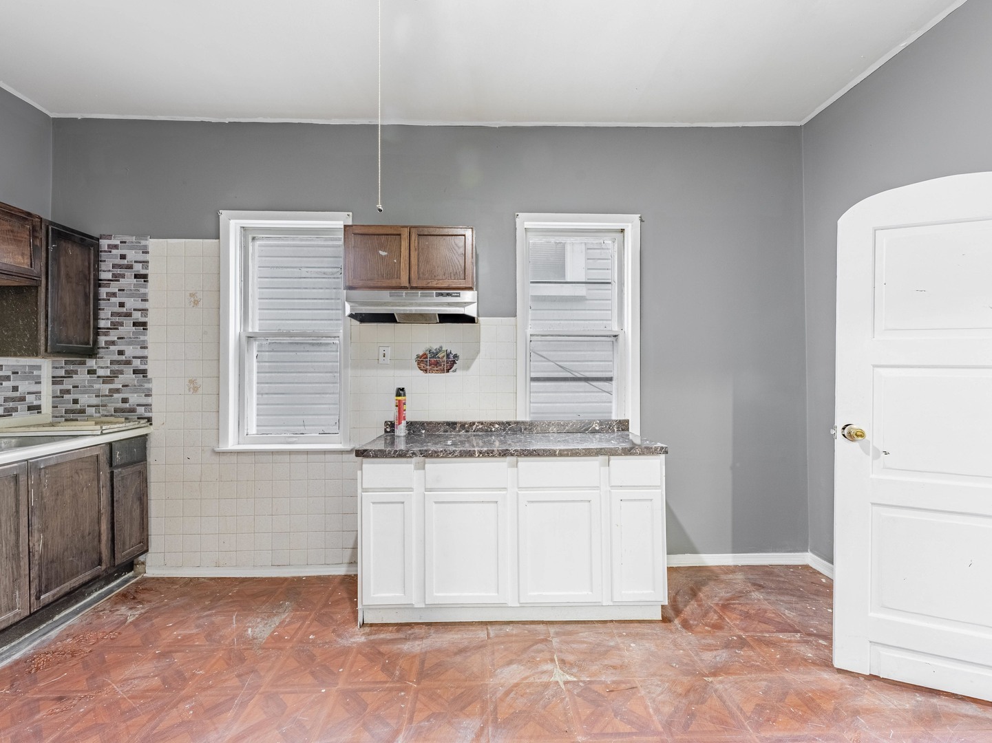 4722 South Ada Street Chicago, IL 60609 - Photo 6 of 14 a bathroom with a granite countertop sink a mirror and a bathtub