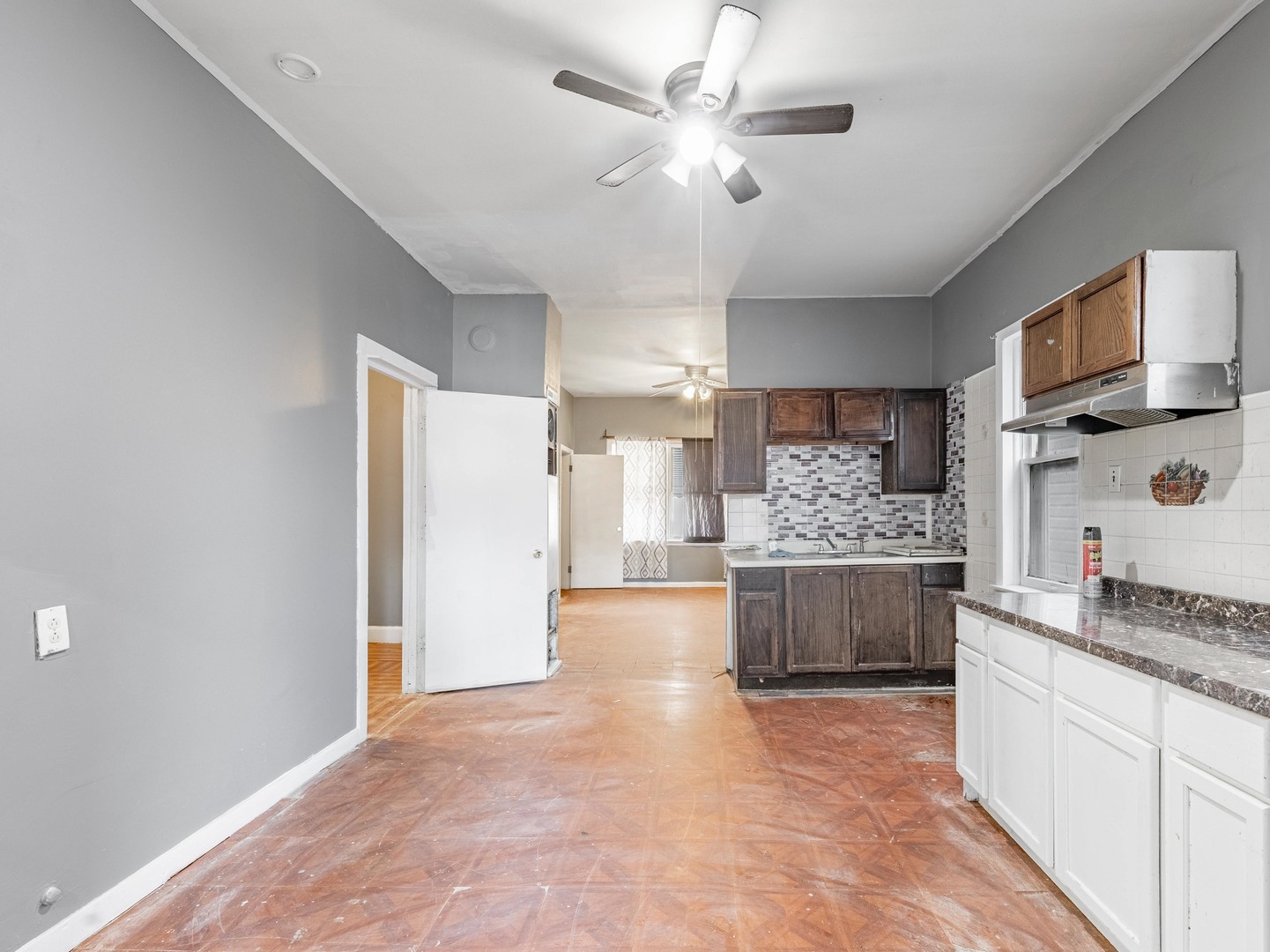 4722 South Ada Street Chicago, IL 60609 - Photo 7 of 14 a large kitchen with kitchen island a stove a sink and a refrigerator