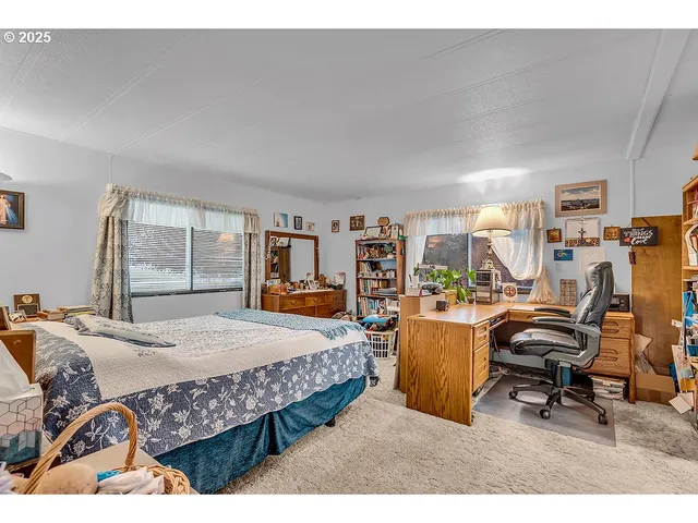 a bed room with furniture and a window