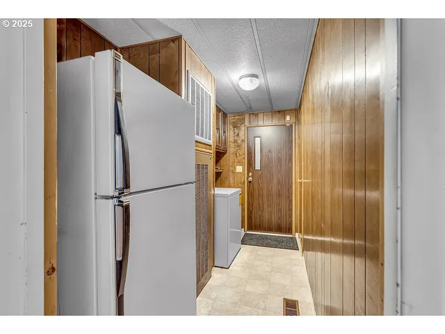 a bathroom with a shower and a glass door
