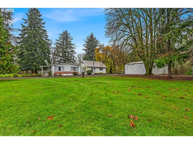 a view of a house with a big yard
