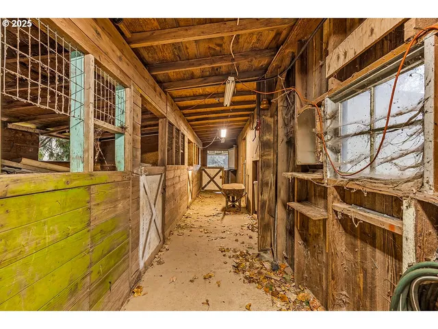 a view of a backyard with wooden fence