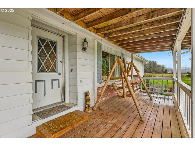 a view of balcony with wooden floor and city view