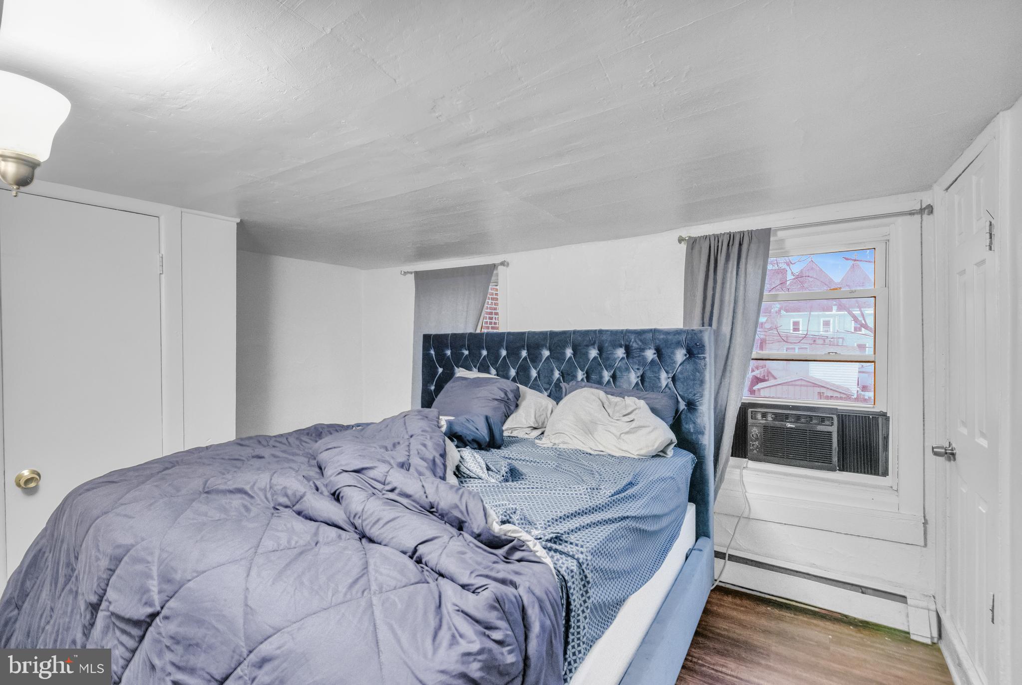 423 North Hall Street Allentown, PA 18102 - Photo 9 of 18 a bedroom with a bed and a window