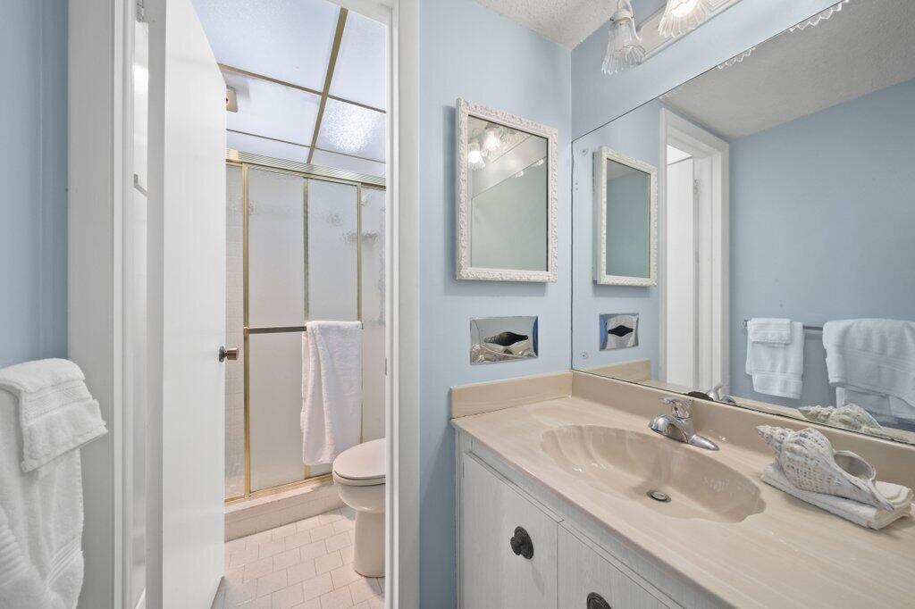5463 Southeast Miles Grant Road, Unit 207 Stuart, FL 34997 - Photo 11 of 19 primarybath1.jpg-SMALL