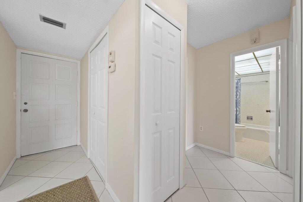 5463 Southeast Miles Grant Road, Unit 207 Stuart, FL 34997 - Photo 3 of 19 foyer1.jpg-SMALL