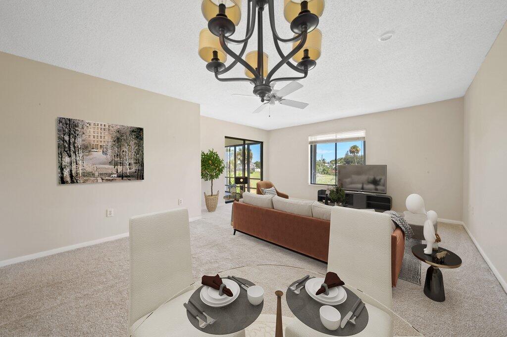 5463 Southeast Miles Grant Road, Unit 207 Stuart, FL 34997 - Photo 4 of 19 diningliving1_staged.jpg-SMALL