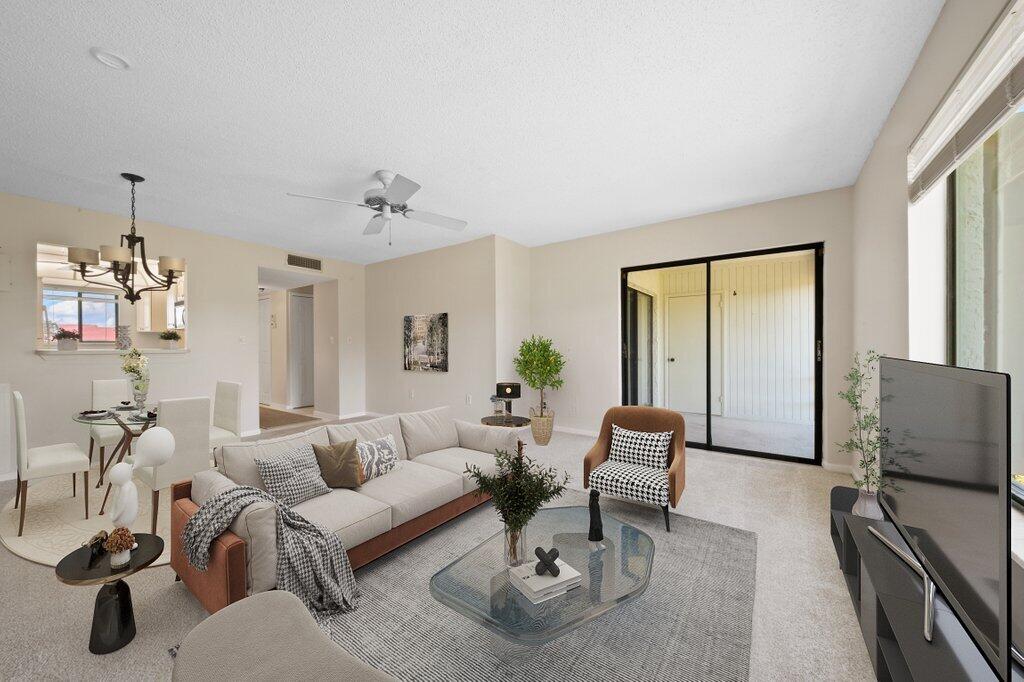 5463 Southeast Miles Grant Road, Unit 207 Stuart, FL 34997 - Photo 5 of 19 livingdining1_staged.jpg-SMALL