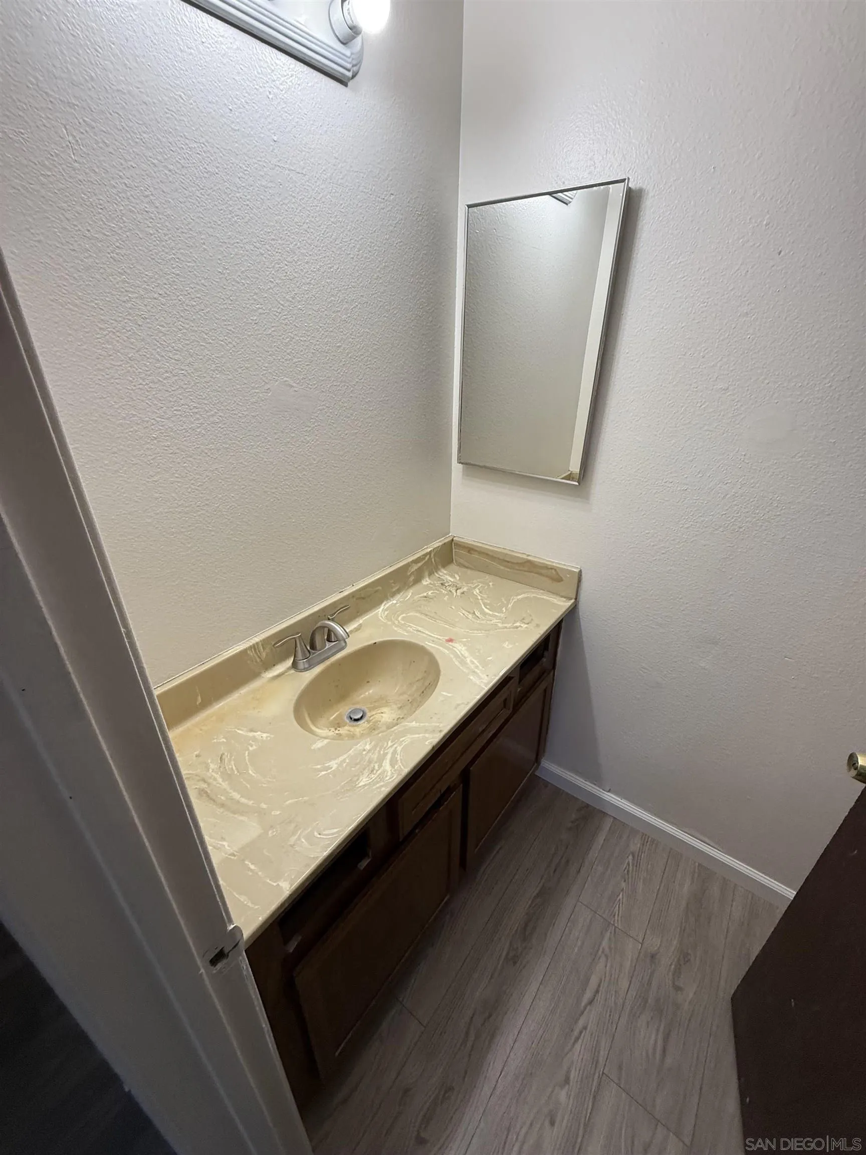 1034 Leland Street, Unit 14 Spring Valley, CA 91977 - Photo 5 of 7 a bathroom with a sink and a mirror