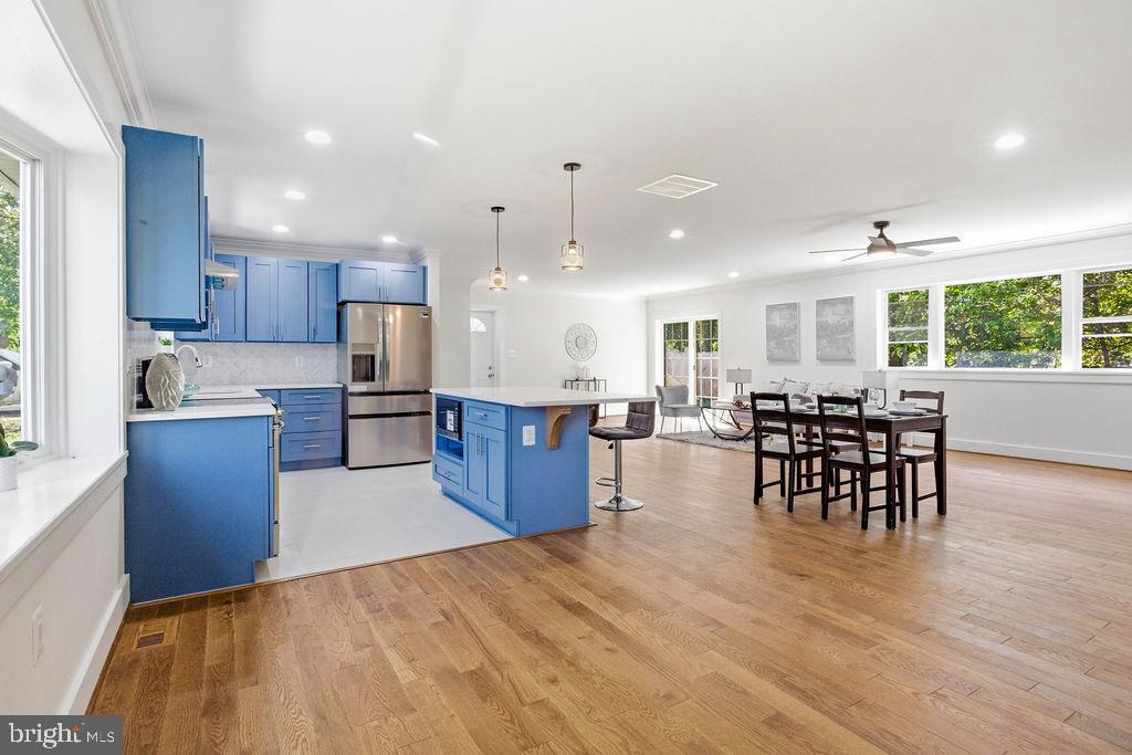 6620 Napoli Road Temple Hills, MD 20748 - Photo 5 of 38 a large kitchen with a table and chairs
