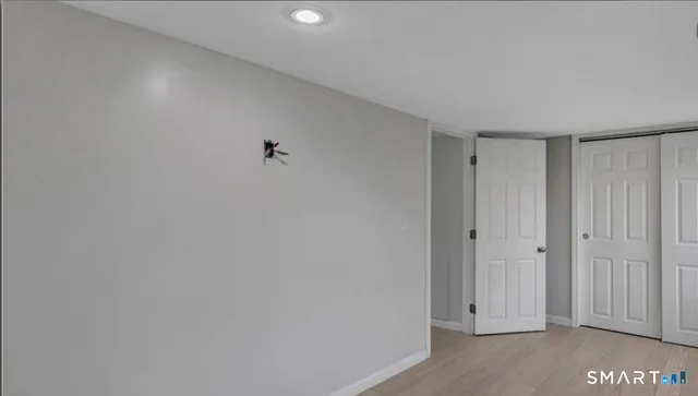 a view of room with hardwood floor