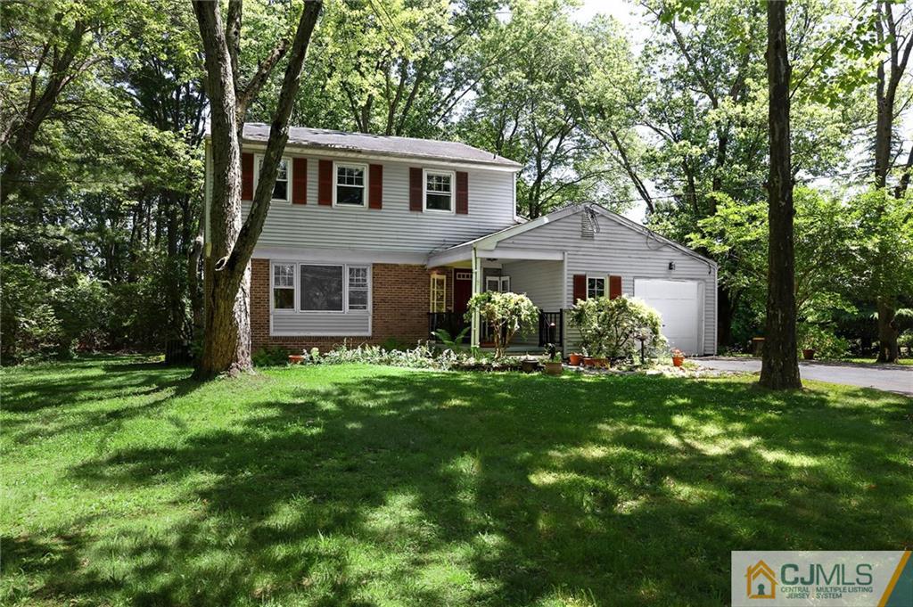 17 Taylor Road Monmouth Junction, NJ 08852 - Photo 2 of 25 a front view of a house with a garden