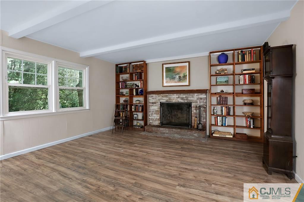 17 Taylor Road Monmouth Junction, NJ 08852 - Photo 14 of 25 a view of a livingroom with furniture and a fireplace