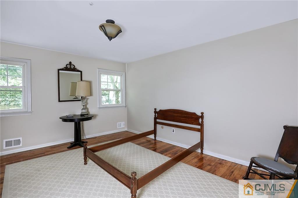 17 Taylor Road Monmouth Junction, NJ 08852 - Photo 16 of 25 a living room with a piano and a window