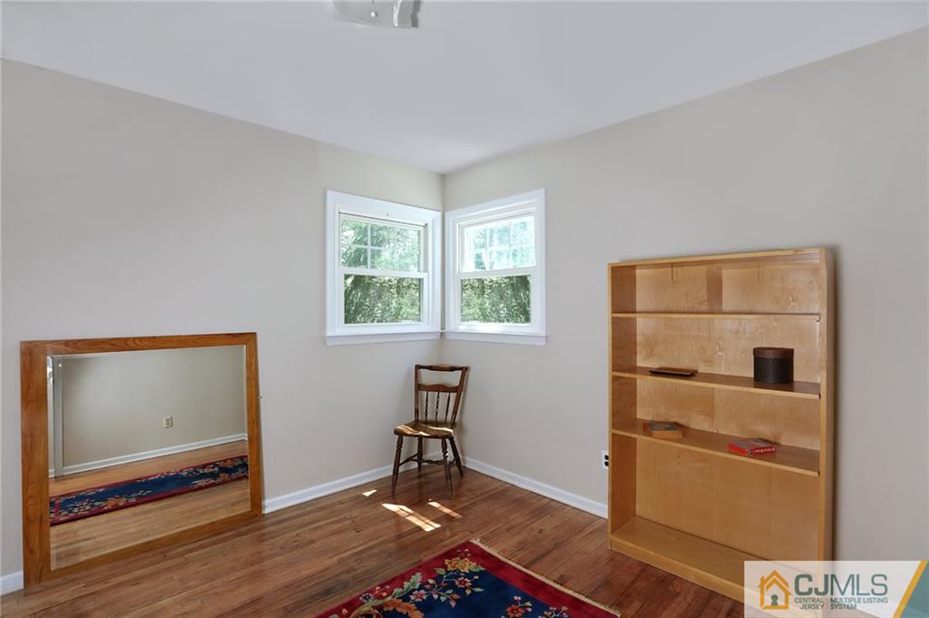17 Taylor Road Monmouth Junction, NJ 08852 - Photo 17 of 25 a view of room with window and wooden floor