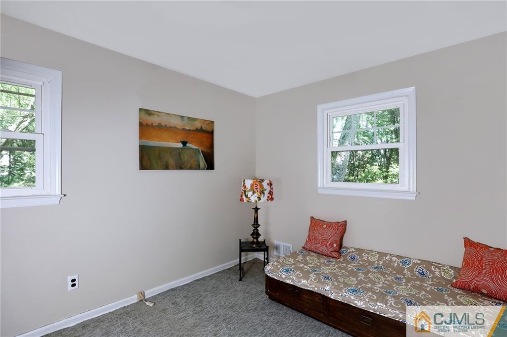 17 Taylor Road Monmouth Junction, NJ 08852 - Photo 18 of 25 a living room with furniture and a window