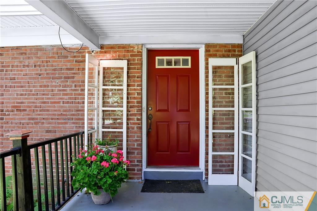 17 Taylor Road Monmouth Junction, NJ 08852 - Photo 3 of 25 a view of front door and potted plants