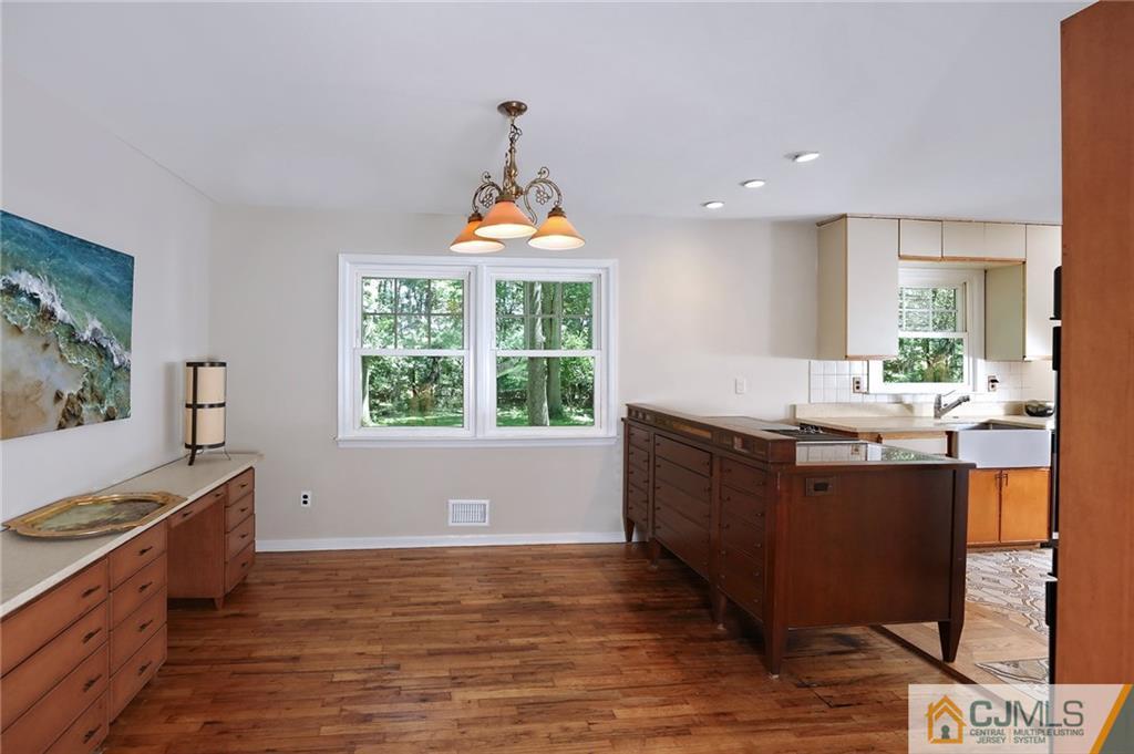 17 Taylor Road Monmouth Junction, NJ 08852 - Photo 8 of 25 a kitchen with stainless steel appliances granite countertop a sink a stove and a wooden floors
