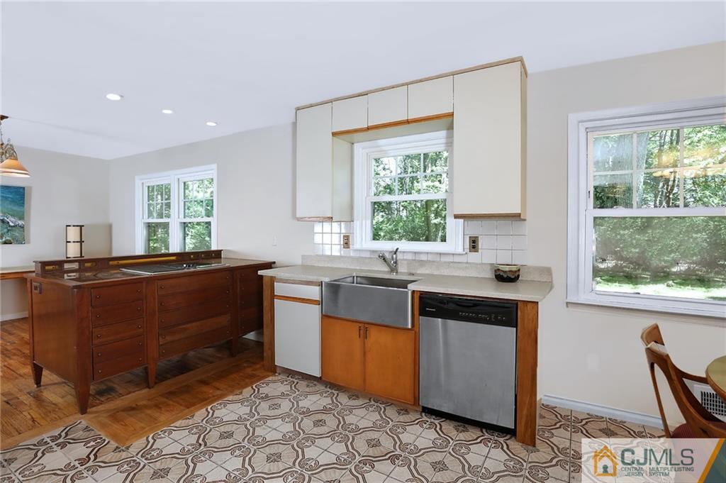 17 Taylor Road Monmouth Junction, NJ 08852 - Photo 10 of 25 a kitchen with a stove a sink and a window