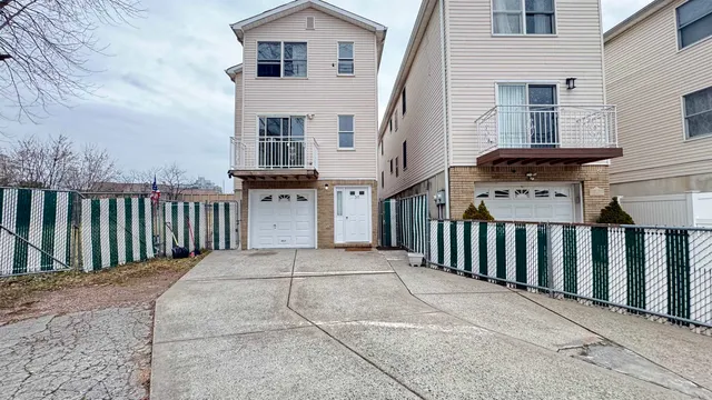 a view of a brick house with large windows
