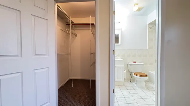 a kitchen with a refrigerator and a sink