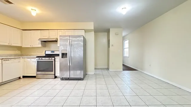 a view of a kitchen with a sink and a stove