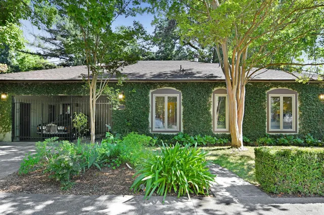 front view of a house with a garden